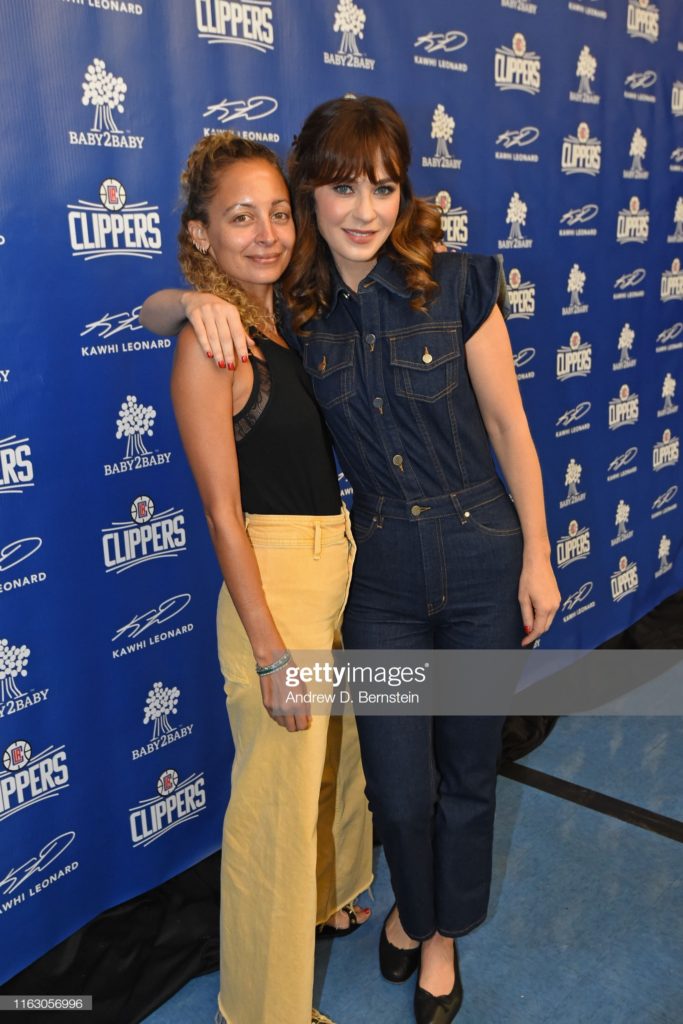 WATTS, CA -AUGUST 20: Nicole Richie, and Zooey Deschanel pose for a photo at LA Clippers, Kawhi Leonard & Gillian Zucker Community Initiative with Baby2Baby at 107th Street Elementary School on August 20, 2019 in Watts, California. NOTE TO USER: User expressly acknowledges and agrees that, by downloading and/or using this Photograph, user is consenting to the terms and conditions of the Getty Images License Agreement. Mandatory Copyright Notice: Copyright 2019 NBAE (Photo by Andrew D. Bernstein/NBAE via Getty Images)