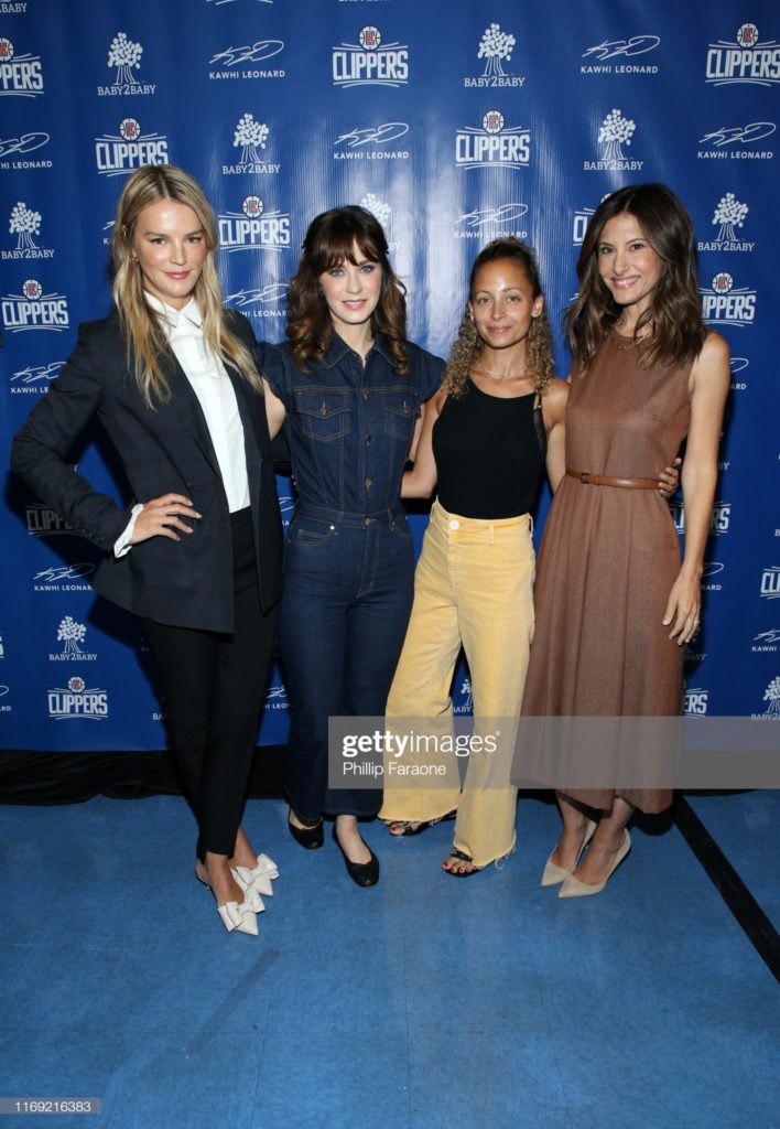 LOS ANGELES, CALIFORNIA - AUGUST 20:  (L-R) Kelly Sawyer Patricof, Zooey Deschanel, Nicole Richie, and Norah Weinstein celebrate donation of One Million backpacks from Baby2Baby, Kawhi Leonard and the L.A. Clippers to students across Los Angeles at 107th Street Elementary on August 20, 2019 in Los Angeles, California. (Photo by Phillip Faraone/Getty Images for Baby2Baby)